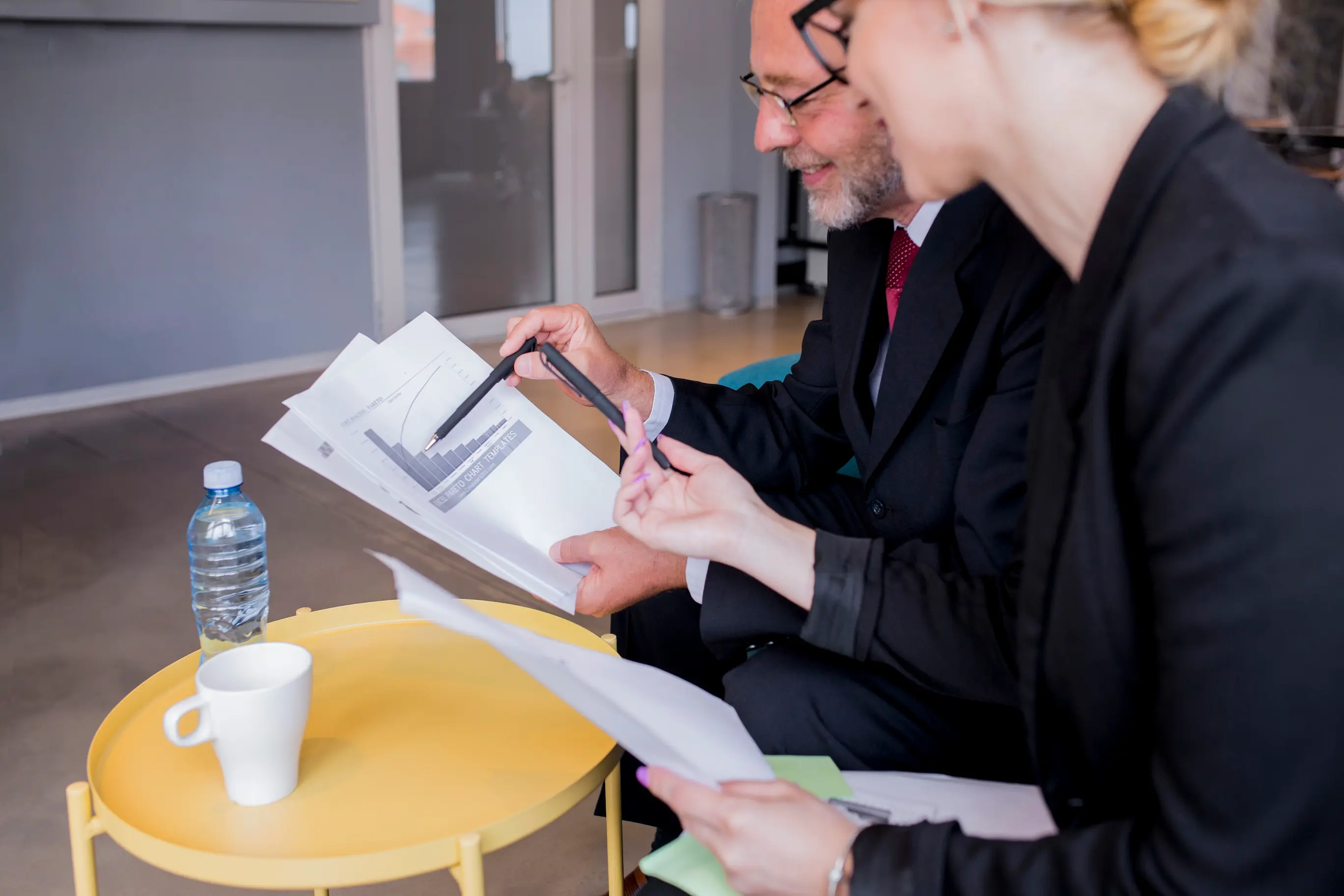 Close up of a couple taking notes